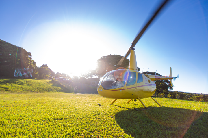 a small plane sitting on top of a grass covered field