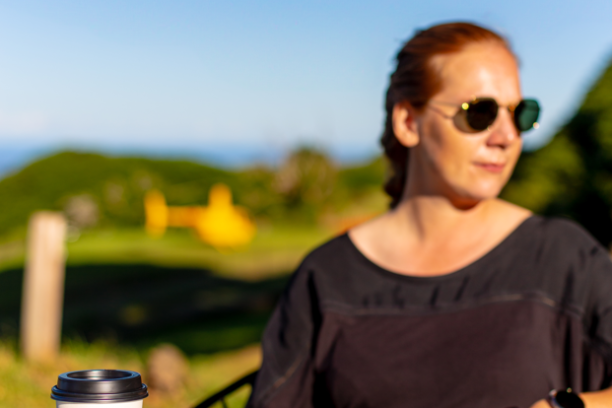 a person sitting at a table using a laptop